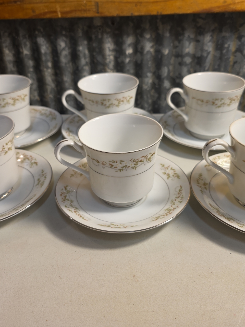 White Porcelain Tea Cup and Saucer Set with Gold Leaf Trim